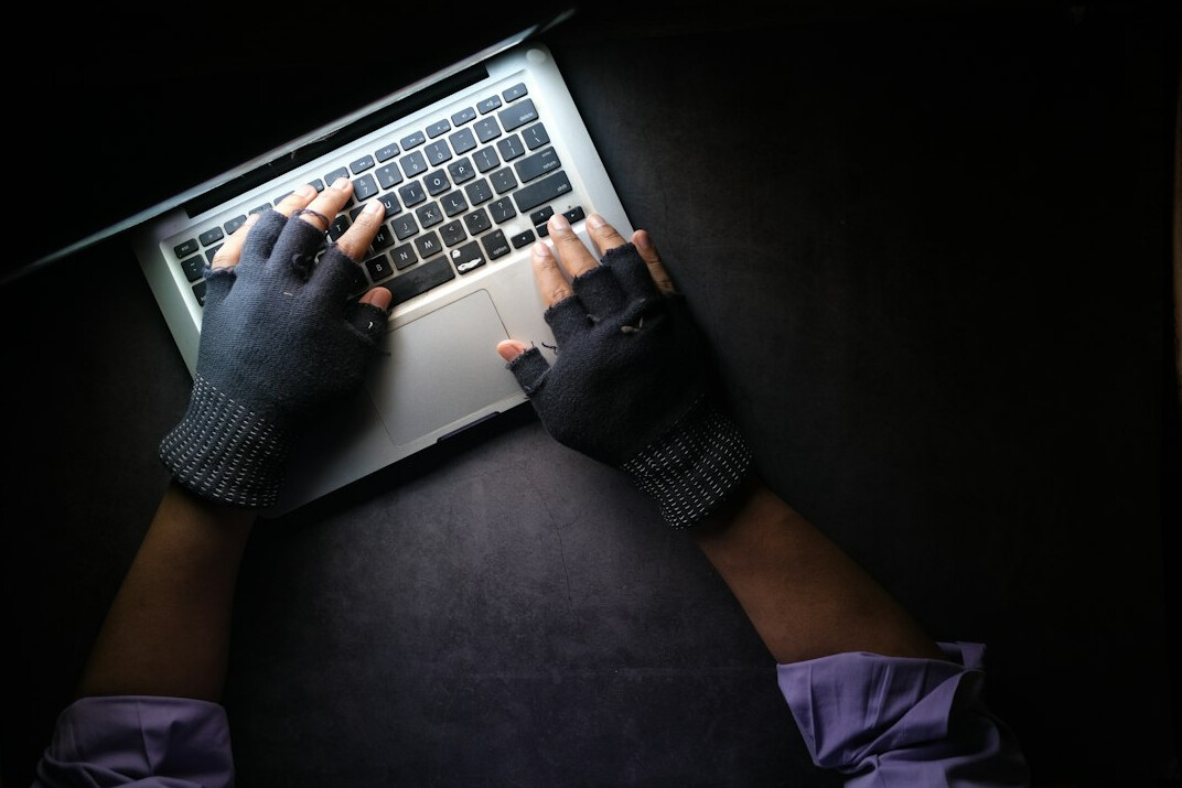 person writing on laptop at night