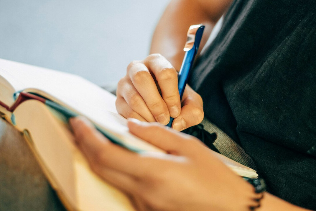 writer with notebook